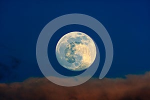 Full moon with colorful cloud and beautiful blue sky