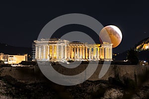 Full moon eclipse over the Parthenon Temple of the Acropolis of Athens, Greece