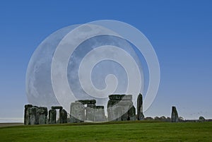 A full moon illuminating the ancient circle at Stonehenge, Wiltshire