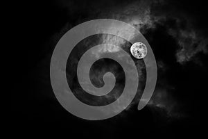 Full moon in the middle of clouds