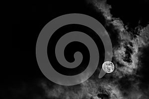 Full moon in the middle of clouds
