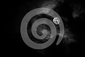 Full moon in the middle of clouds