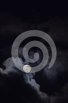 Full moon in the middle of clouds