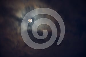 Full moon in the middle of clouds