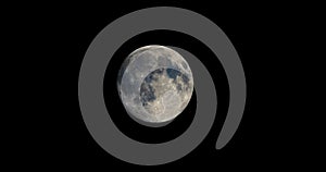 Full moon moving in the sky seen with telescope