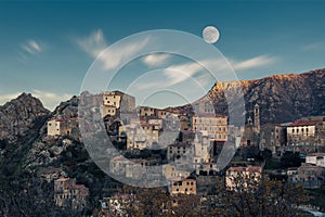 Full moon over Balagne village of Speloncato in Corsica