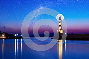 Full moon over Lighthouse of Chania at summer sunse