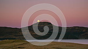 Full moon over mountains - Isle of Skye - purple morning sky and huge moon