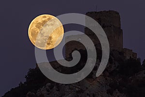 Full moon over Ocio castle photo