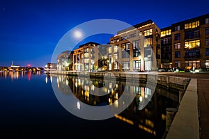 The full moon over a waterfront apartment building in Fells Point, Baltimore, Maryland.