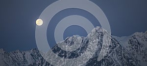 Full moon rise over the Lyngen Alps in northern Norway