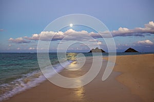 Full moon rising at lanikai beach, hawaii