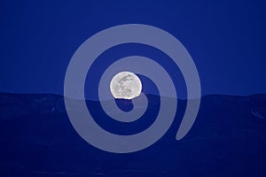 Full moon rising over Sierra Ancha Range photo