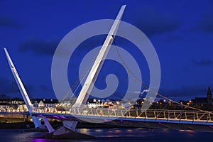 Full moon rising by Peace Bridge in Derry