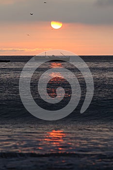 Full moon sunset and fishing boat , chorrillos, lima, peru. water sky clouid photo