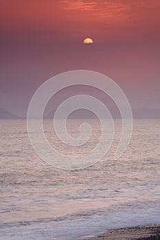Full moon sunset and and waves , playa san pedro, lima, peru. water sky clouid photo