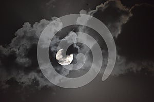 Full moon view during cloudy night in the sky photo