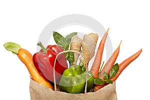 Full paper bag of different health food on a white background. The concept of healthy food, proper nutrition. Top view. Flat lay