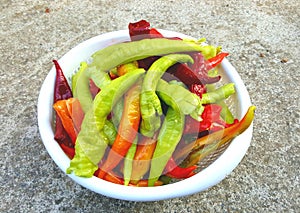 full plastic bowl  of fresh organic paprika . Healthy food concept