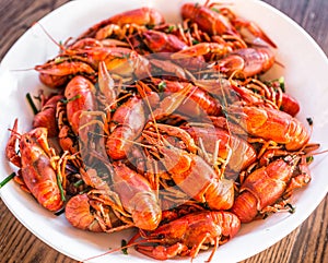 Full plate of boiled crayfishes. Top view