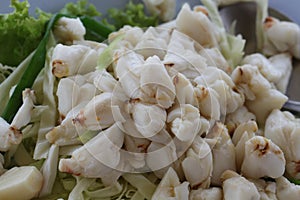 Full plate of fresh crab meat of boiled stone Crab decorated with vegetable side dish, Cheliped of the crab