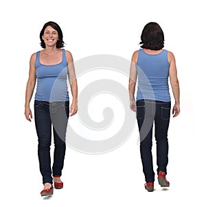 Full portrait of a same pregnant woman walking and with casual clothes on white background, front and back view
