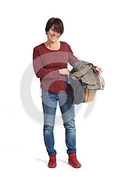 full portrait of a woman with a laundry basket on white background