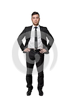 Full portrait of young business man, put his hands on waist, isolated, white background