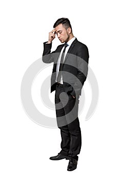 Full portrait of young man in business suit, thinking about something, isolated on a white background