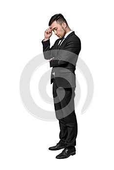 Full portrait of young man in business suit, thinking about something, isolated on a white background