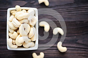 Full Raw Cashew Nuts in white ceramic bowl