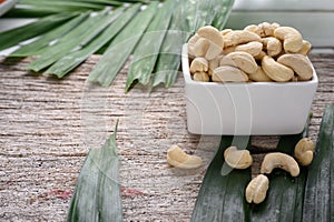 Full Raw Cashew Nuts in white ceramic bowl