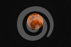 The full red moon in black sky