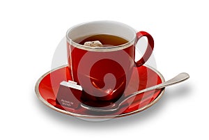 Full Red Teacup and Saucer with Teabag Isolated on