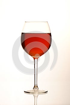 full red wine glass and reflection
