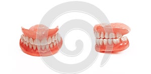 Full removable plastic denture of the jaws. Set of dentures on a white background. A side view of a dental prosthesis, isolate.