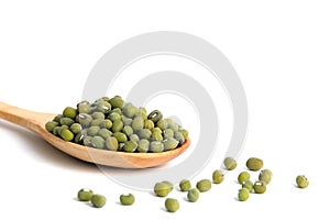 Full scoop of raw mung bean â€“ mung seed on wooden spoon â€“ isolated on a white background