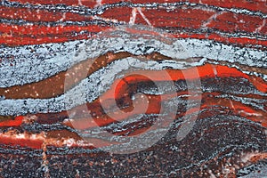 Full-screen texture of red ferruginous quartzite jaspillite rock