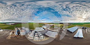 full seamless 360 hdri panorama view among farming field on rows of agro silos granary elevator with seeds cleaning line on agro-