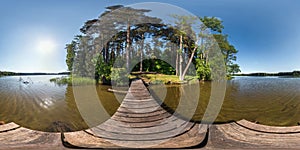 Full seamless panorama 360 by 180 angle view on the pier of a huge forest lake in sunny summer day in equirectangular projection,