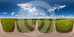 full seamless spherical aerial hdri panorama 360 view on crossroads of no traffic gravel road junction in fields in