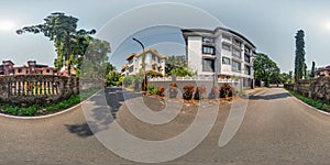 full seamless spherical hdr 360 panorama view among green street with cottages, villas and coconut trees in an indian tropic