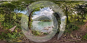 Full seamless spherical hdr panorama 360 degrees angle view among the bushes of forest near river or lake high in mountains in photo
