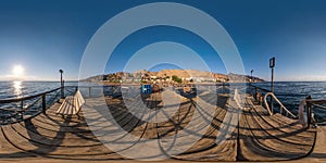 Full seamless spherical hdr 360 panorama view on coast of sea with wooden pier and sun loungers by red sea in bright sunny day in photo