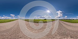 full seamless spherical hdri 360 panorama view on no traffic gravel road among fields in summer day with awesome clouds in