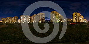 Full seamless spherical hdri night panorama 360 degrees angle view light in windows of multistory building area of urban