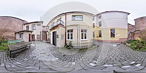Full seamless spherical hdri panorama 360 degrees angle near old houses in narrow courtyard of city bystreet in equirectangular
