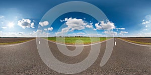 Full seamless spherical hdri panorama 360 degrees angle view on asphalt road among fields in summer day with awesome clouds in