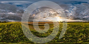 Full seamless spherical hdri panorama 360 degrees angle view among fields in summer evening sunset with awesome in equirectangular
