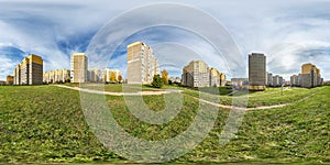 Full seamless spherical hdri panorama 360 degrees angle view light in windows of multistory building area of urban development